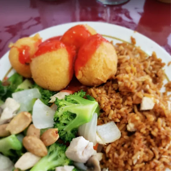 Fried rice, broccoli, chicken and fried dumplings